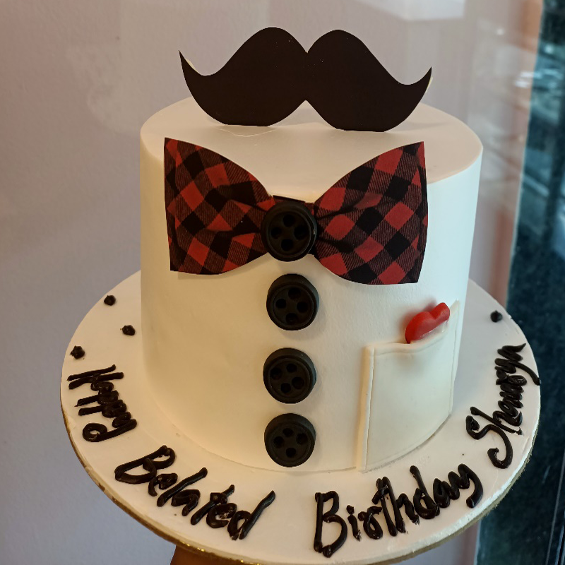 Shirt and bow with mustache theme cake