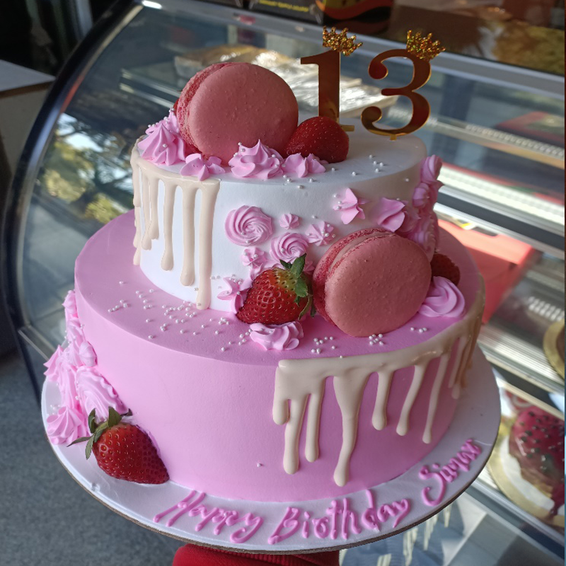Pink theme cake with macroons