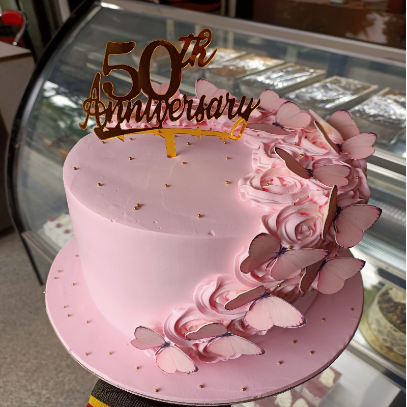 Pink butterflies theme cake with roses